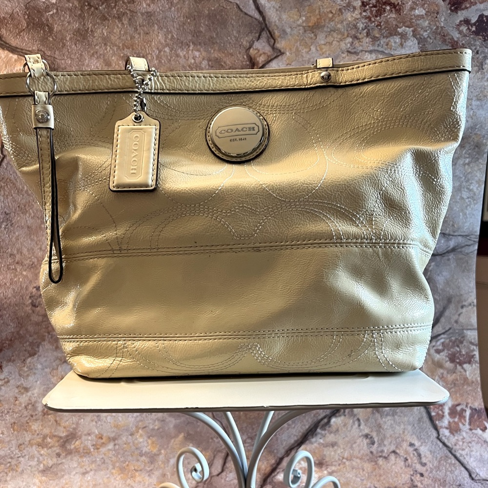 Coach handbag.  Creamy white color.  Medium size.